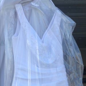 white satin a line wedding dress and veil.